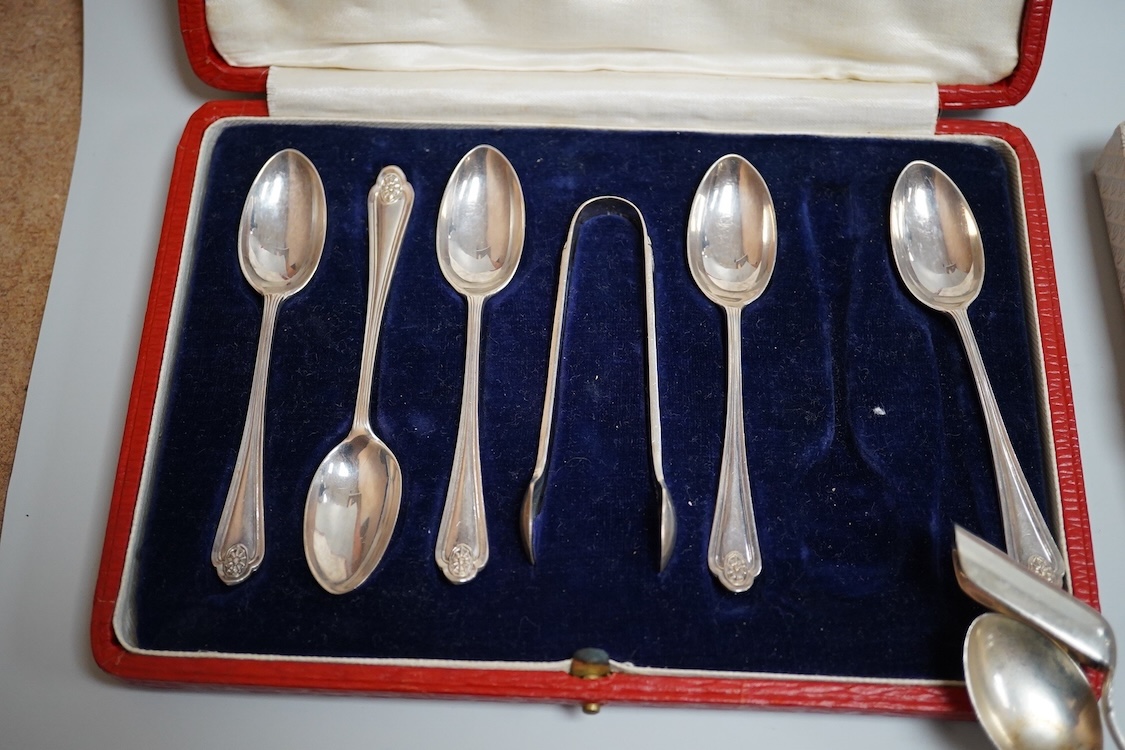 A cased set of five(ex 6) silver teaspoons and pair of sugar tongs, a set of six shell end coffee spoons, five other silver items of flatware, a boxed set of six 830 standard white metal teaspoons, an 800 standard shovel